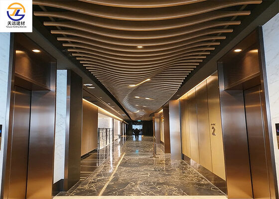 Curved Aluminum Baffle Ceiling | Dynamic Wave Design for Luxury Elevator Lobbies