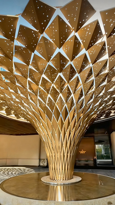 Shaped aluminum veneer column cladding for hotel atriums – perforated/carved options, fully customizable colors.