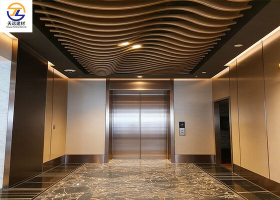 Curved Aluminum Baffle Ceiling | Dynamic Wave Design for Luxury Elevator Lobbies
